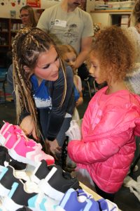 Photo of child selecting new shoes