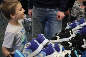 Photo of child selecting new shoes