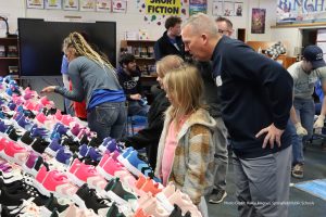 Photo of child selecting new shoes