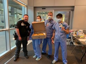 doctors at cox south ER holding boxes of pizza delivered by Vito's Kitchen