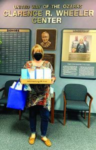 Lisa Farmer of Harmony House receives Covid relief supplies.