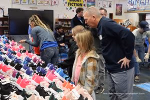 Photo of child selecting new shoes
